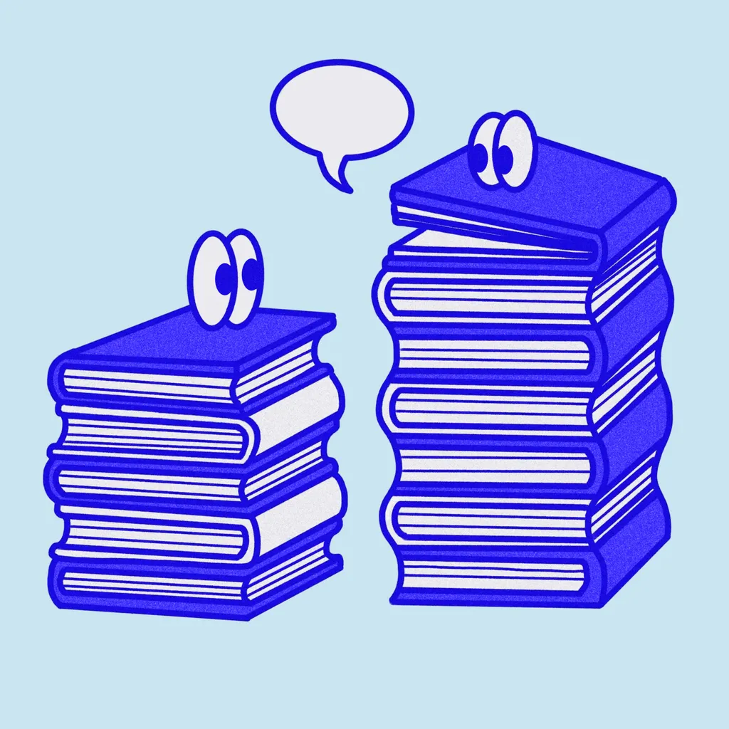 Two stacks of books each with googley eyes on top looking at each other.